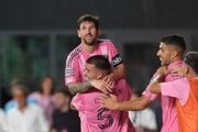 Inter Miami defender Marcelo Weigandt (57) lifts forward Lionel Messi as teammates celebrate after Weigandt scored his side's second goal during stoppage time at the end of a Leagues Cup group stage 