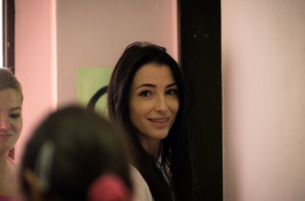 Lucia Hablovičová, model and TV host, painting individual rooms in a facility for for children and adults with mental disabilities.