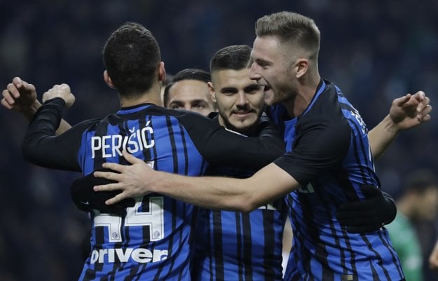 Inter Milan's Mauro Icardi celebrates with Milan Škriniar (R), and Ivan Perišič after scoring a goal during a Series A match between Inter Milan and Atalanta. 