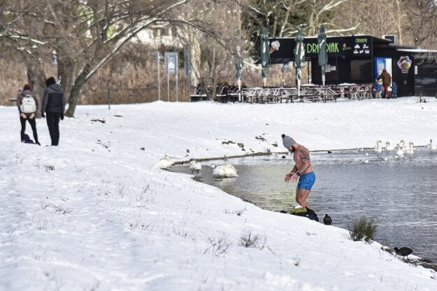 A winter swimming enthusiast comes out of the Veľký Draždiak lake in the Bratislava borough of Petržalka on January 13, 2021.