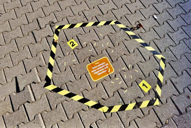 This place has been cleaned up of cigarette butts, a sticker on the pavement reads.