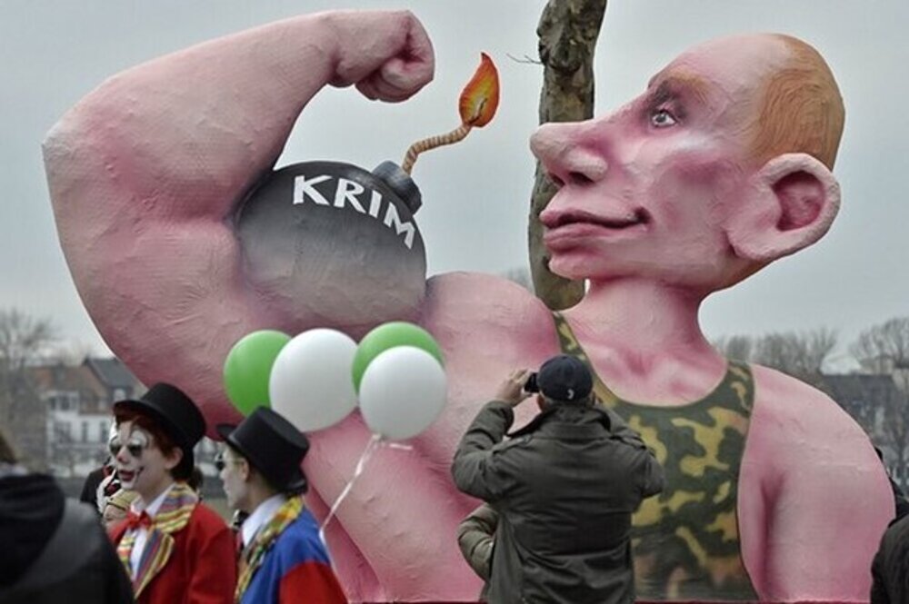 Putin’s attack on Crimea was even noticed at a carnival in Düsseldorf, Germany.