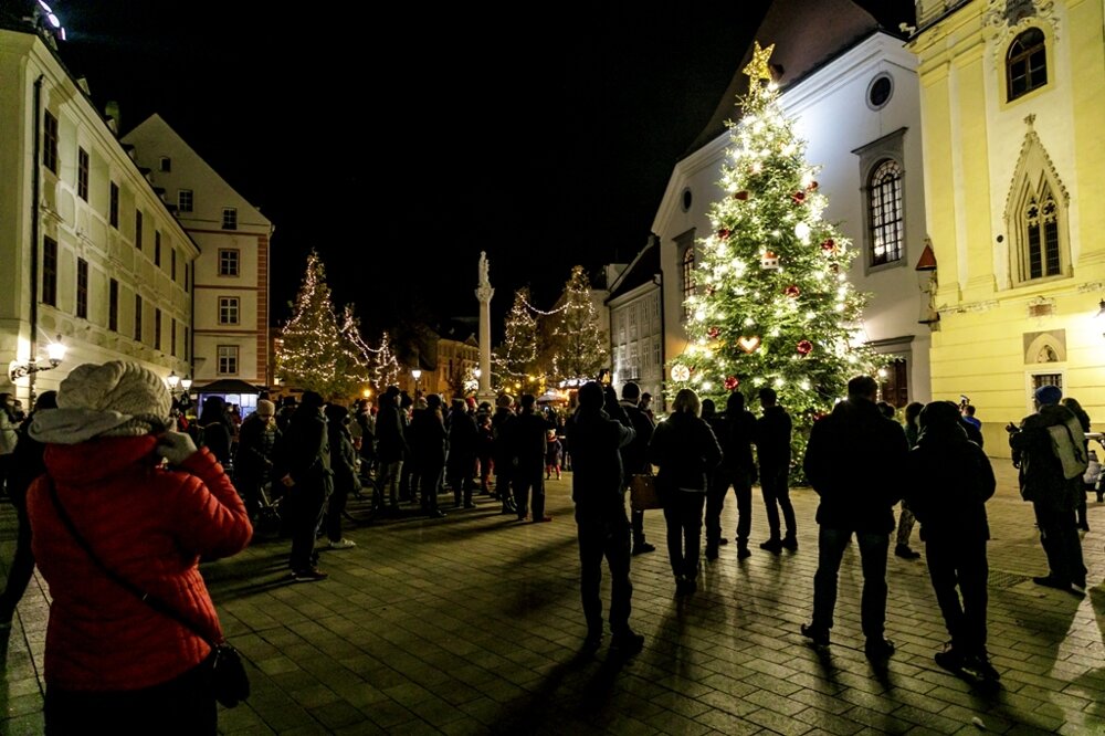 The lights on the Christmas tree are on.