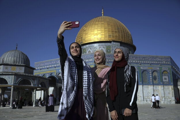 Women pose for a selfie in Jerusalem.