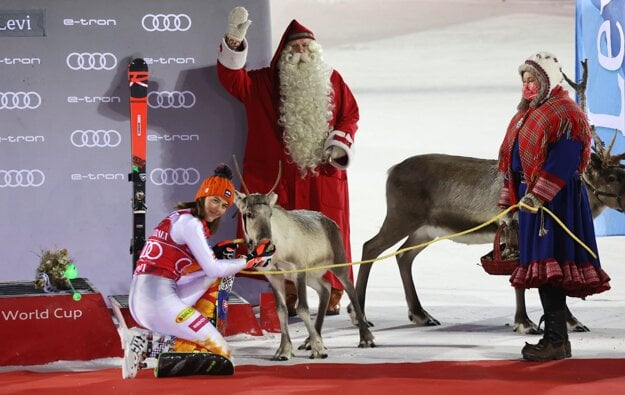 Slovakia's Petra Vlhová feeds a reindeer on the podium after winning an alpine skiing, World Cup women's slalom in Levi, Finland on Sunday.