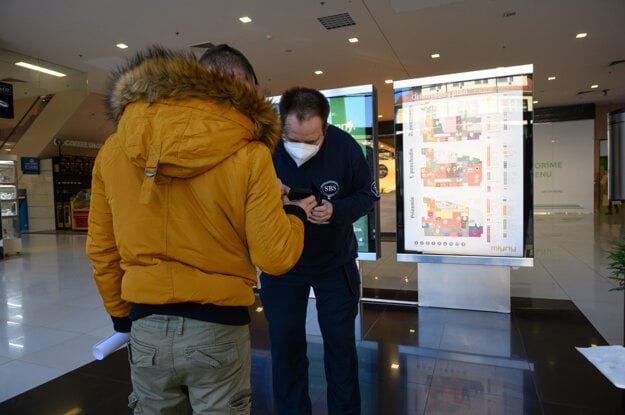 Checking Green passes after entering the shopping centre