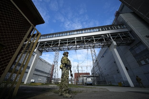 Russian servicemen guard an area of the Zaporizhzhia Nuclear Power Station in territory under Russian military control, southeastern Ukraine.