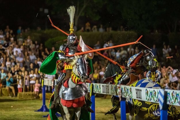 A knight rides a horse during the tournament.