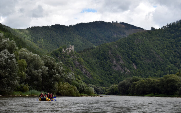 Rafters on the Váh River. The castle called Starhrad can be seen in the background.