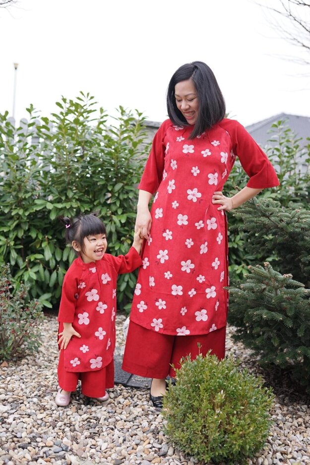 Niki and her daughter wear traditional Vietnamese costumes.