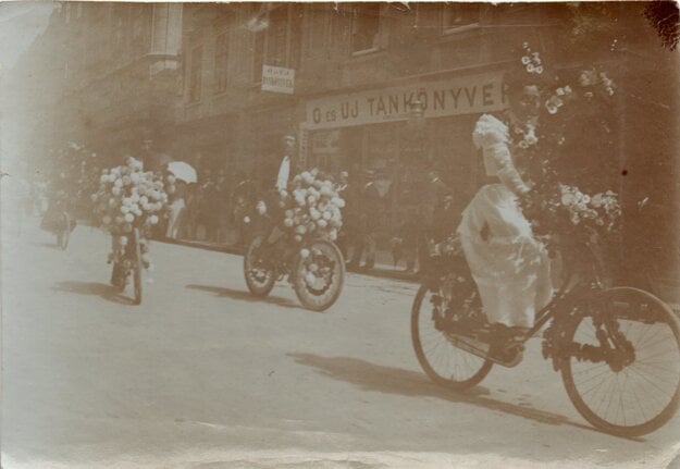 A historical photo of a flower cycling ride in Bratislava