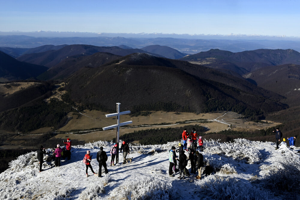 A group of tourists hiked to the top of the Strážov peak, the highest point in the Strážovské Vrchy mountains, above the village of Zliechov in Trenčín Region.