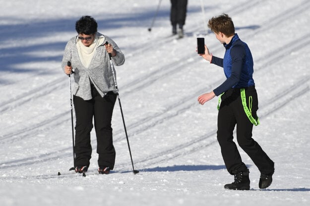 Sport enthusiasts of all ages cross-country ski on the groomed tracks in Štrbské Pleso, High Tatras region, on February 25.