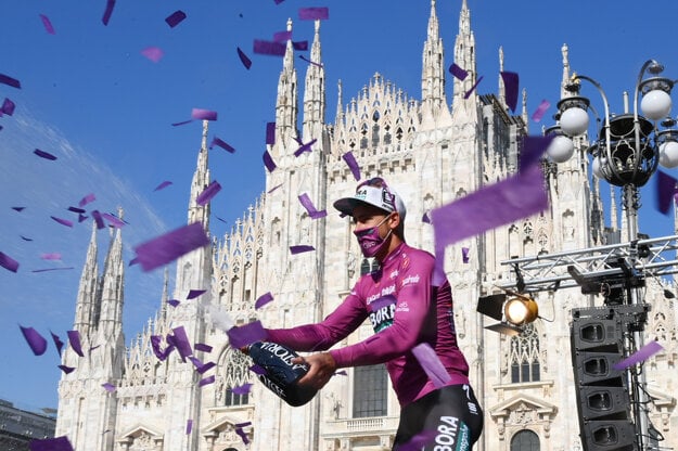 Slovakia's Peter Sagan sprays champagne from the podium after the final stage of the Giro d'Italia cycling race, a 30.3 kilometers individual time trial from Senago to Milan, Italy on May 30, 2021.