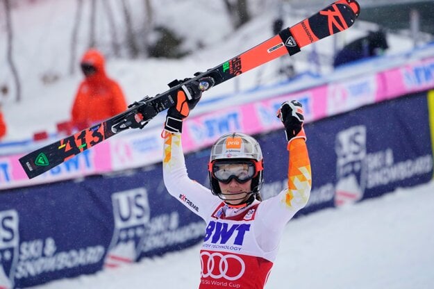 Petra Vlhová celebrates after crossing the finish line.