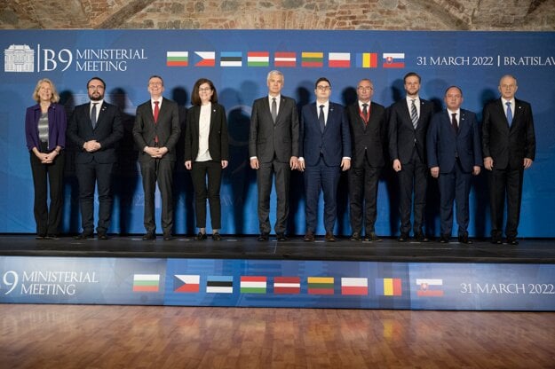 From right, NATO Deputy Secretary General Mircea Geoana, Romania's Foreign Minister Bogdan Aurescu, Lithuanian Foreign Minister Gabrielius Landsbergis, State Secretary at the Ministry of Foreign Affairs of Hungary Peter Sztaray, Czech Foreign Minister Jan Lipavsky,Slovakia's Foreign Affairs Minister Ivan Korcok, Bulgaria's Minister of Foreign Affairs Teodora Genchovska, Latvia's Foreign Minister Edgars Rinkevics, Deputy Minister of Foreign Affairs of Poland Pawiel Jablonsky and Assistant Secretary of State for European and Eurasian Affairs Karen Donfried gather for a group photo during the informal meeting of foreign affairs ministers of NATO's eastern flank, a platform known as the Bucharest Nine (B9), in Bratislava, Slovakia, Thursday, March 31, 2022