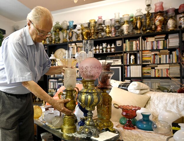 Collector Cyril Barla from Košice with his collection of oil and kerosene lamps.