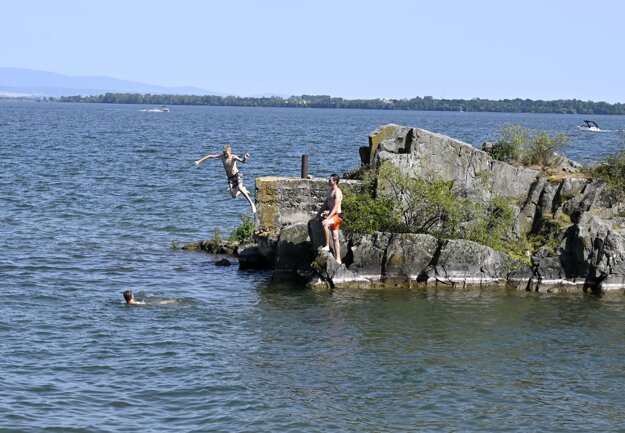 Children jumping into the Zemplínska Šírava dam in eastern Slovakia on June 19, 2022.