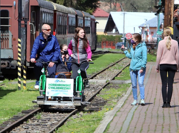 Tourists ride rail bikes on the legendary tracks in Čierny Balog, central Slovakia, on May 16, 2021.