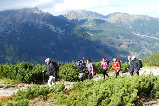 Tourists walk on a hiking trail in the Western Tatras.