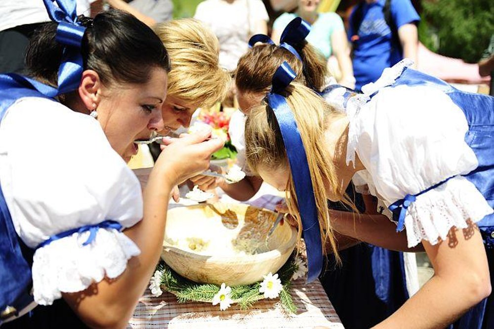 Competing in halušky eating.