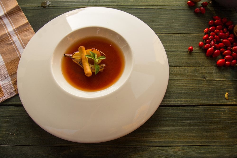 A soup from rosehips with red wine and pear