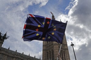 A pro EU protestor waves flags opposite the House of Parliament in London in April 2019.