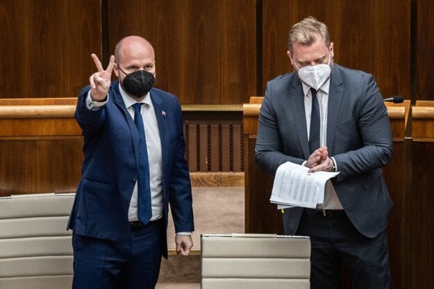 Defence Minister Jaroslav Naď (l) and OĽaNO MP Juraj Krúpa (r) after the voting on the Defence Cooperation Agreement with the USA.