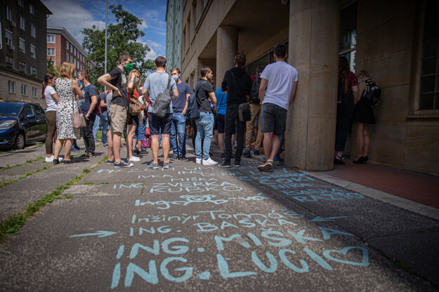 University students are standing outside a building.