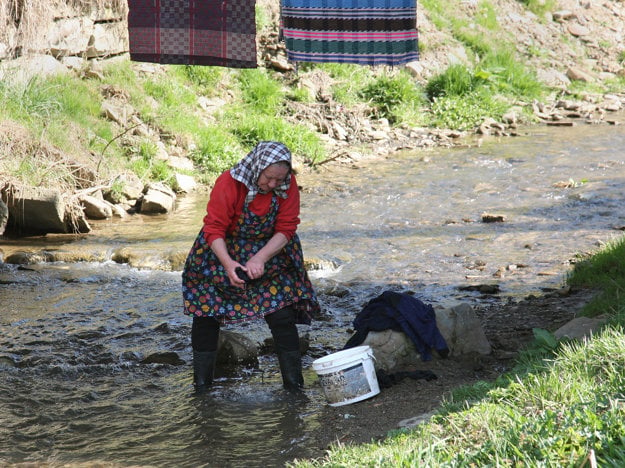 Old way of washing clothes, illustrative stock photo