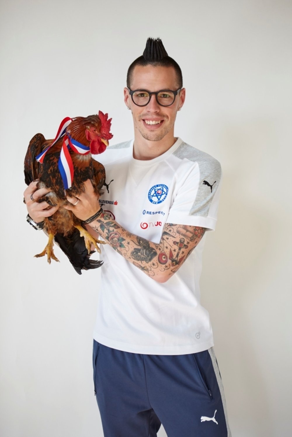 A rooster on the head, a rooster in the hands.
