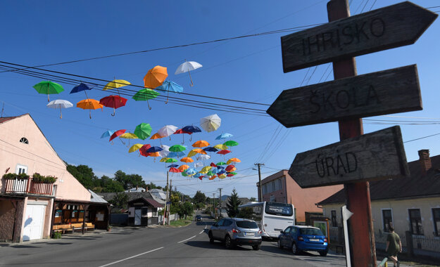 Umbrellas are installed up in the air and above the main road in Trstené pri Hornáde near Košice.