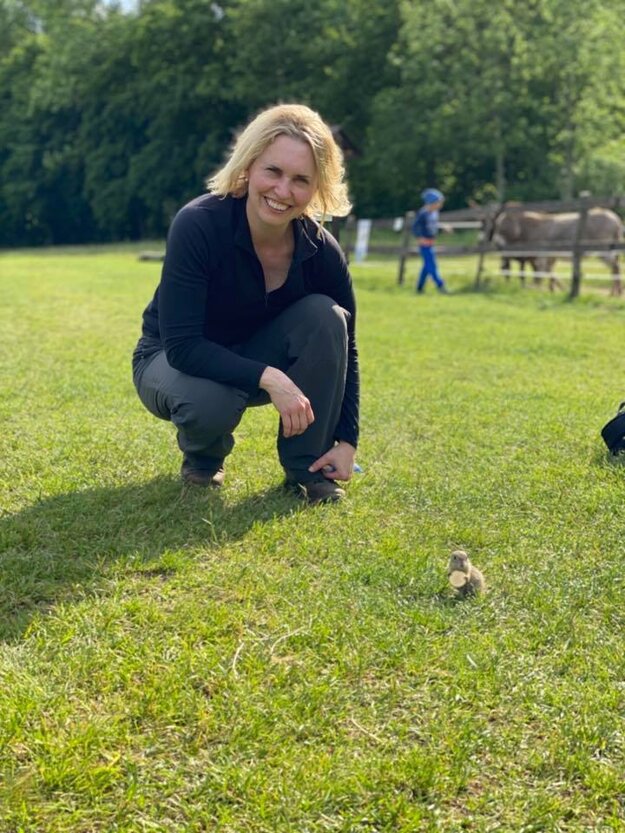 US Ambassador Bridget Brink with a ground squirrel in the Muránska planina national park. 