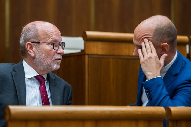 Foreign Minister Rastislav Káčer (left) attends a parliamentary session on September 27, 2022.